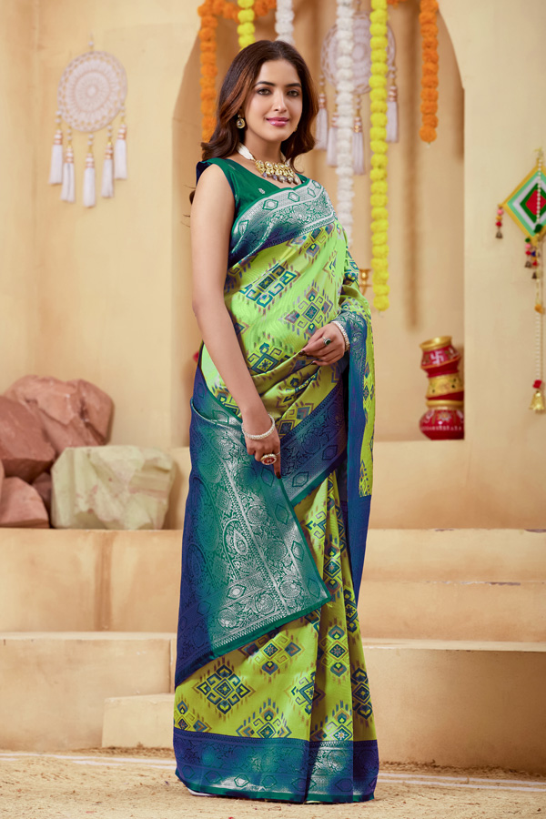 Woven Design Zari Patola Saree Geometric Woven Design Zari Patola Saree + Elevate your ethnic wardrobe with this stunning lime green saree featuring a unique geometric pattern saree design. The blend of lime green, teal green, and peacock green tones creates a refreshing and modern appeal, perfect for festive and traditional occasions. Crafted with intricate zari woven saree detailing, this saree showcases a rich contrast border saree style that enhances its elegance. The luxurious texture resembles pure saree silk, making it an ideal choice for those who love silk saree collections with a contemporary twist.