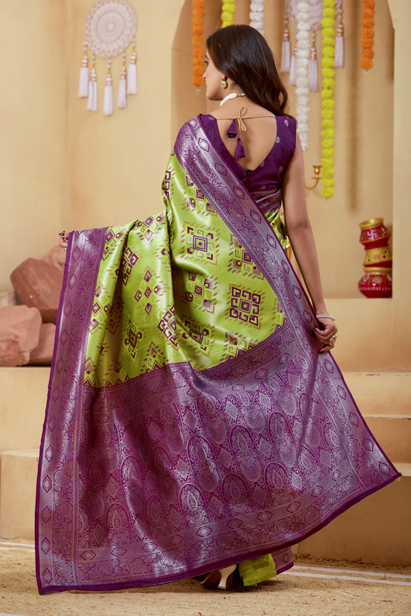 Woven Design Zari Patola Saree Woven Design Zari Patola Saree + Elevate your ethnic style with this stunning lime green burgundy woven design zari patola saree, a perfect blend of tradition and elegance. Crafted in luxurious silk saree fabric, this new saree features intricate zari detailing that adds a rich and festive touch to your look. This patola saree silk design showcases beautiful shades like parrot green saree, bottle green saree, and peacock green saree tones, making it a versatile addition to your saree collection. Ideal for weddings and celebrations, this designer silk saree reflects timeless craftsmanship.