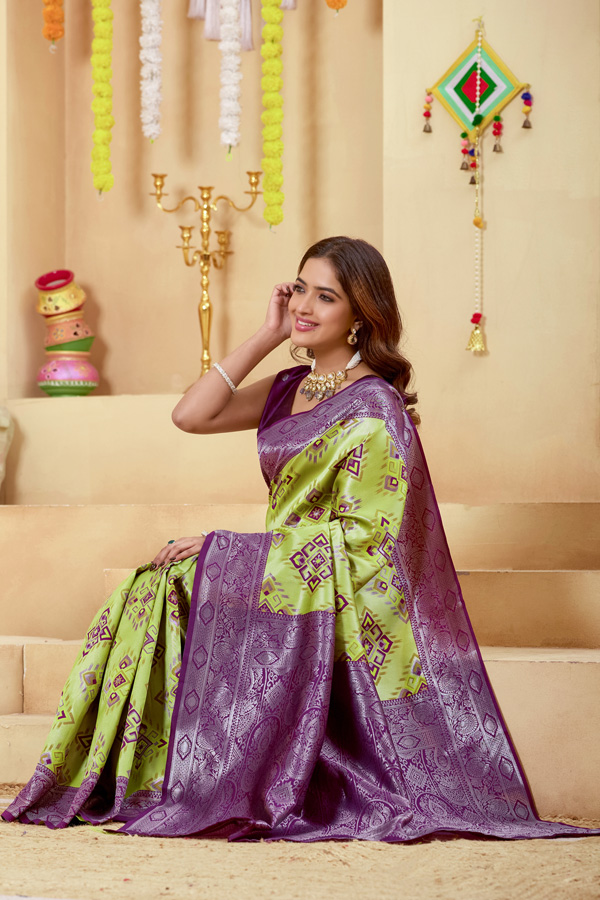 Woven Design Zari Patola Saree Woven Design Zari Patola Saree + Elevate your ethnic style with this stunning lime green burgundy woven design zari patola saree, a perfect blend of tradition and elegance. Crafted in luxurious silk saree fabric, this new saree features intricate zari detailing that adds a rich and festive touch to your look. This patola saree silk design showcases beautiful shades like parrot green saree, bottle green saree, and peacock green saree tones, making it a versatile addition to your saree collection. Ideal for weddings and celebrations, this designer silk saree reflects timeless craftsmanship.