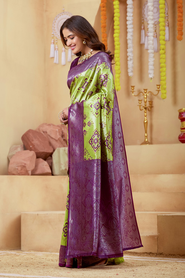 Woven Design Zari Patola Saree Woven Design Zari Patola Saree + Elevate your ethnic style with this stunning lime green burgundy woven design zari patola saree, a perfect blend of tradition and elegance. Crafted in luxurious silk saree fabric, this new saree features intricate zari detailing that adds a rich and festive touch to your look. This patola saree silk design showcases beautiful shades like parrot green saree, bottle green saree, and peacock green saree tones, making it a versatile addition to your saree collection. Ideal for weddings and celebrations, this designer silk saree reflects timeless craftsmanship.