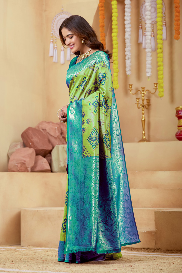 Woven Design Zari Patola Saree Geometric Woven Design Zari Patola Saree + Elevate your ethnic wardrobe with this stunning lime green saree featuring a unique geometric pattern saree design. The blend of lime green, teal green, and peacock green tones creates a refreshing and modern appeal, perfect for festive and traditional occasions. Crafted with intricate zari woven saree detailing, this saree showcases a rich contrast border saree style that enhances its elegance. The luxurious texture resembles pure saree silk, making it an ideal choice for those who love silk saree collections with a contemporary twist.