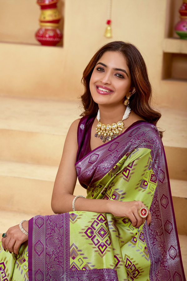 Woven Design Zari Patola Saree Woven Design Zari Patola Saree + Elevate your ethnic style with this stunning lime green burgundy woven design zari patola saree, a perfect blend of tradition and elegance. Crafted in luxurious silk saree fabric, this new saree features intricate zari detailing that adds a rich and festive touch to your look. This patola saree silk design showcases beautiful shades like parrot green saree, bottle green saree, and peacock green saree tones, making it a versatile addition to your saree collection. Ideal for weddings and celebrations, this designer silk saree reflects timeless craftsmanship.